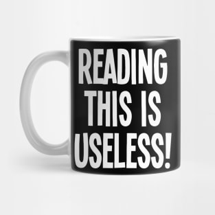 Reading This Is Useless Mug